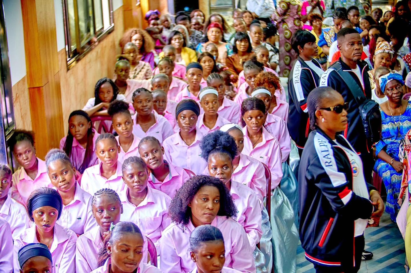 Congregation in matching pink shirts during a Liloba service