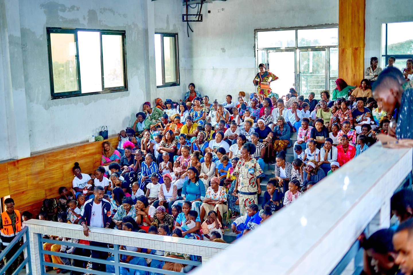 Women and children gathered in the Liloba hall
