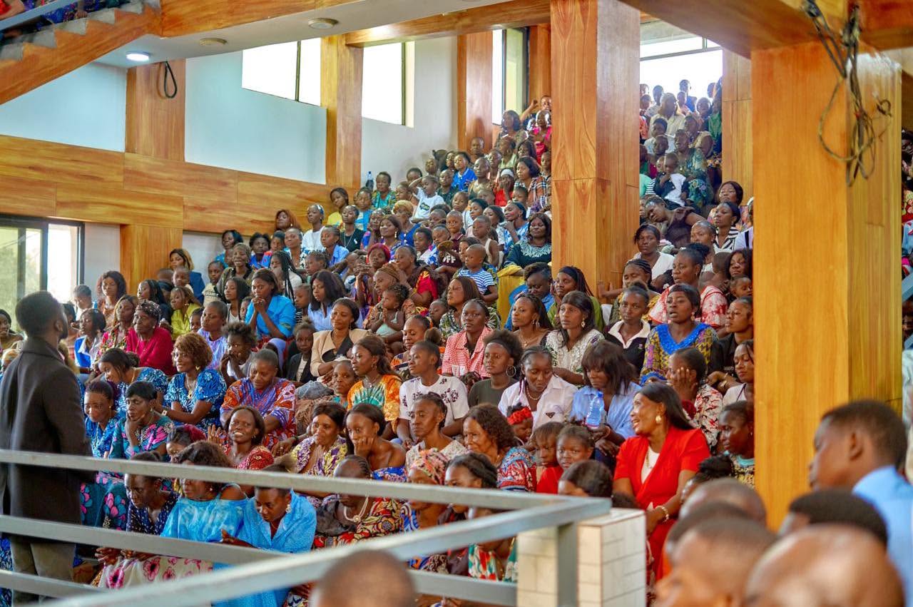 Women of the congregation in the tiered seating of the Liloba hall